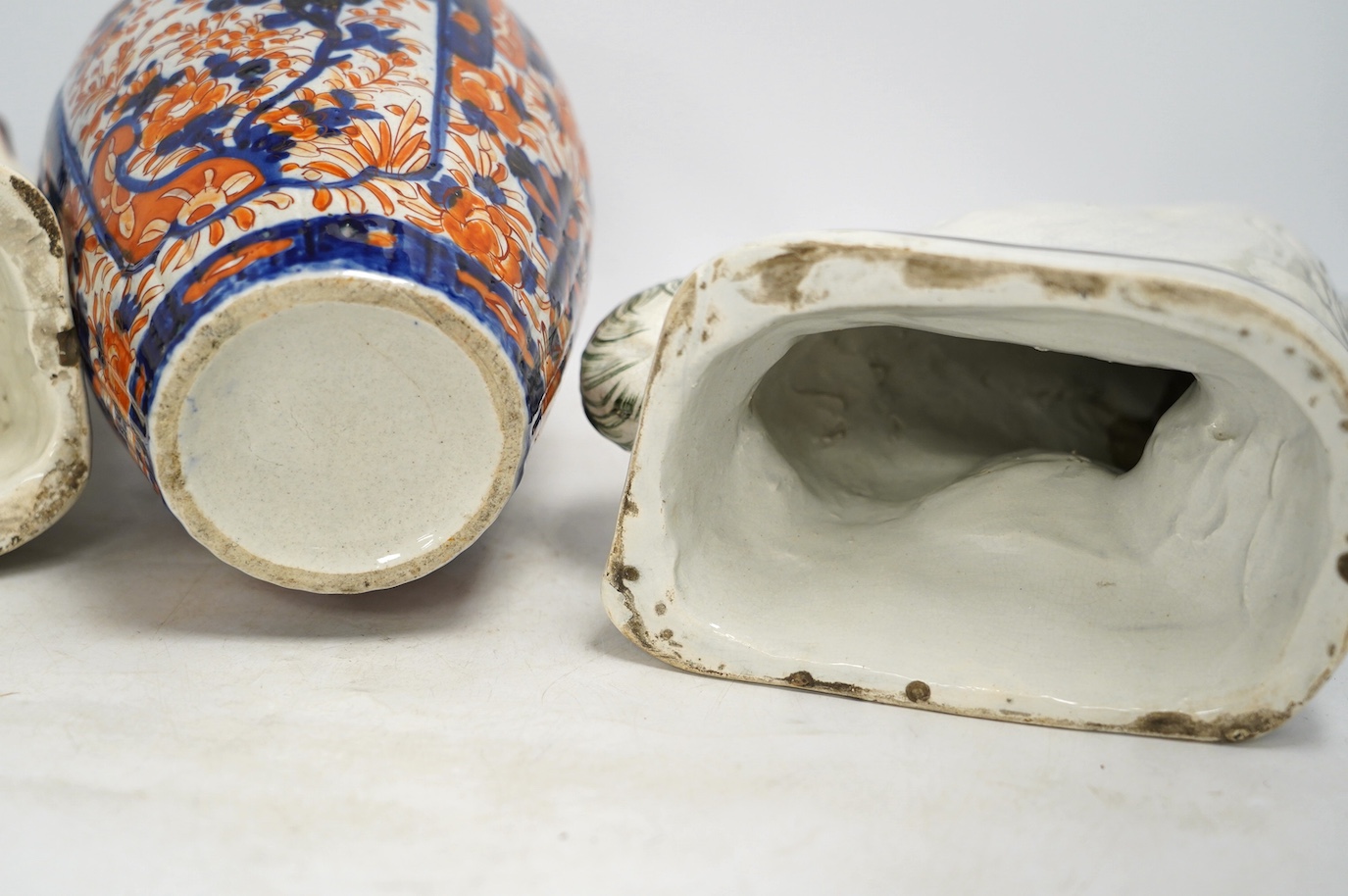 A pair of Victorian comforter spaniels and an Imari vase, vase 31cm high. Condition - fair, vase with a crack to the base